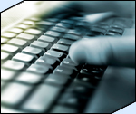 Photo of hand typing on keyboard